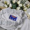 White Swiss Lawn chadar featuring elegant bow-style stonework along the border